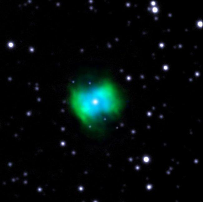 False color image of the planetary nebula NGC 6778. In blue, the emission associated with weak lines of ion O++ recombination, taken with the OSIRIS tunable filter blue instrument in the GTC. In green, emission of the same ion in the excited lines by coll
